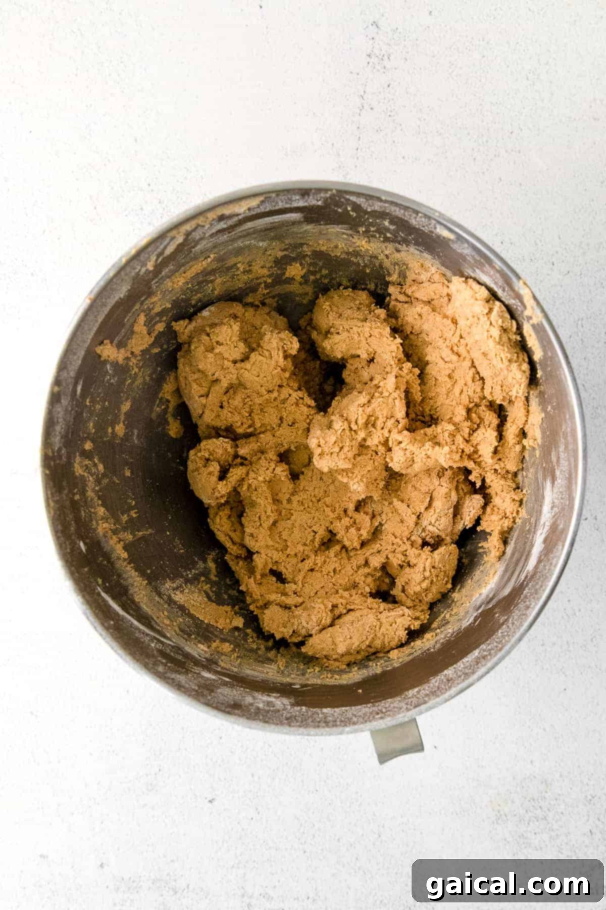 Maple Sugar Cookie Dough Smooth, golden cookie dough resting in a mixing bowl, perfectly prepared for chilling.