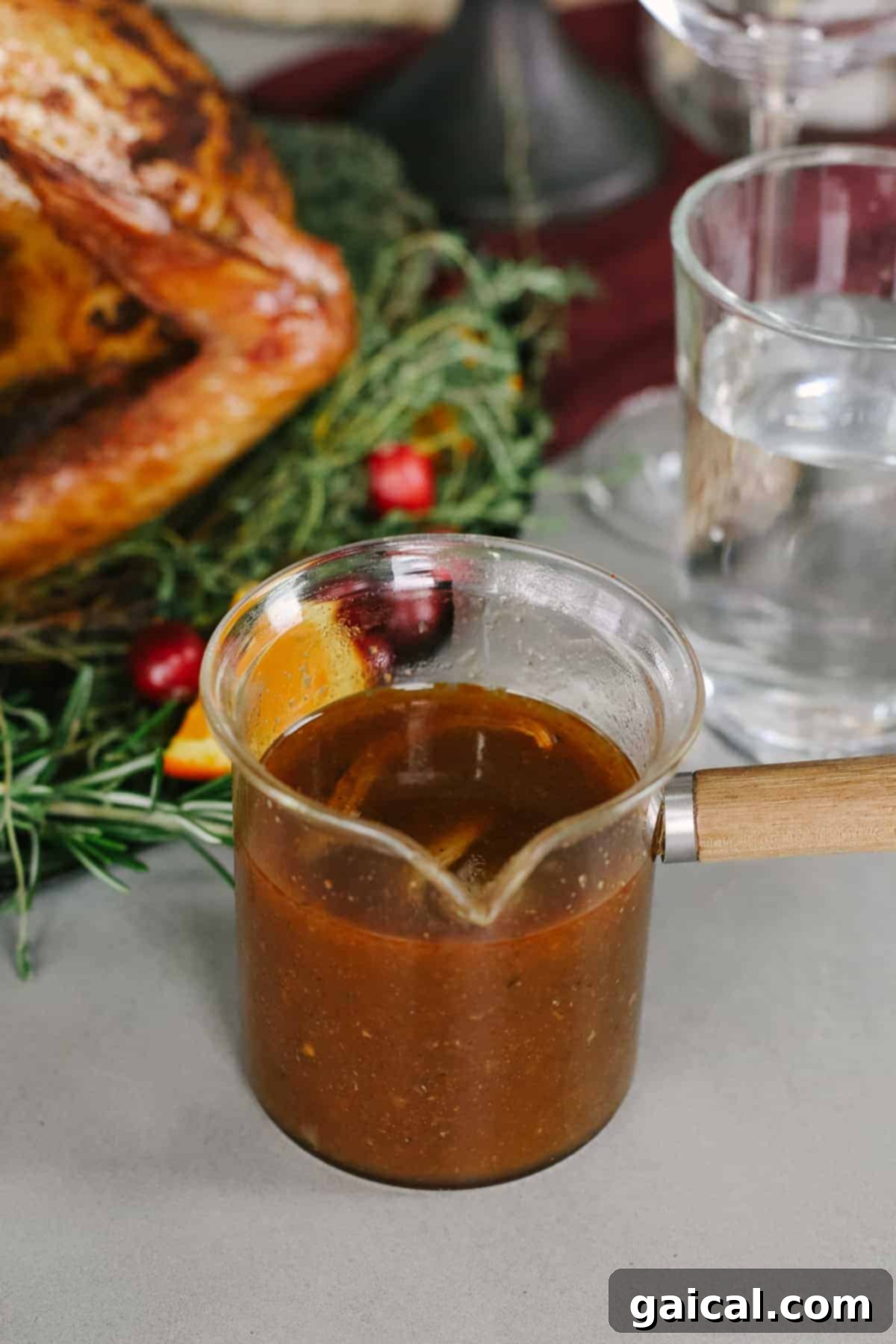 A elegant gravy boat filled with rich, homemade mushroom gravy, ready to be served on a Thanksgiving table.