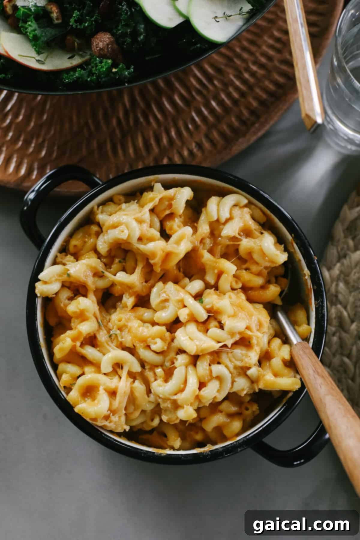 A rich, golden-brown smoked mac and cheese in a casserole dish, ready to be served as a delightful Thanksgiving side.