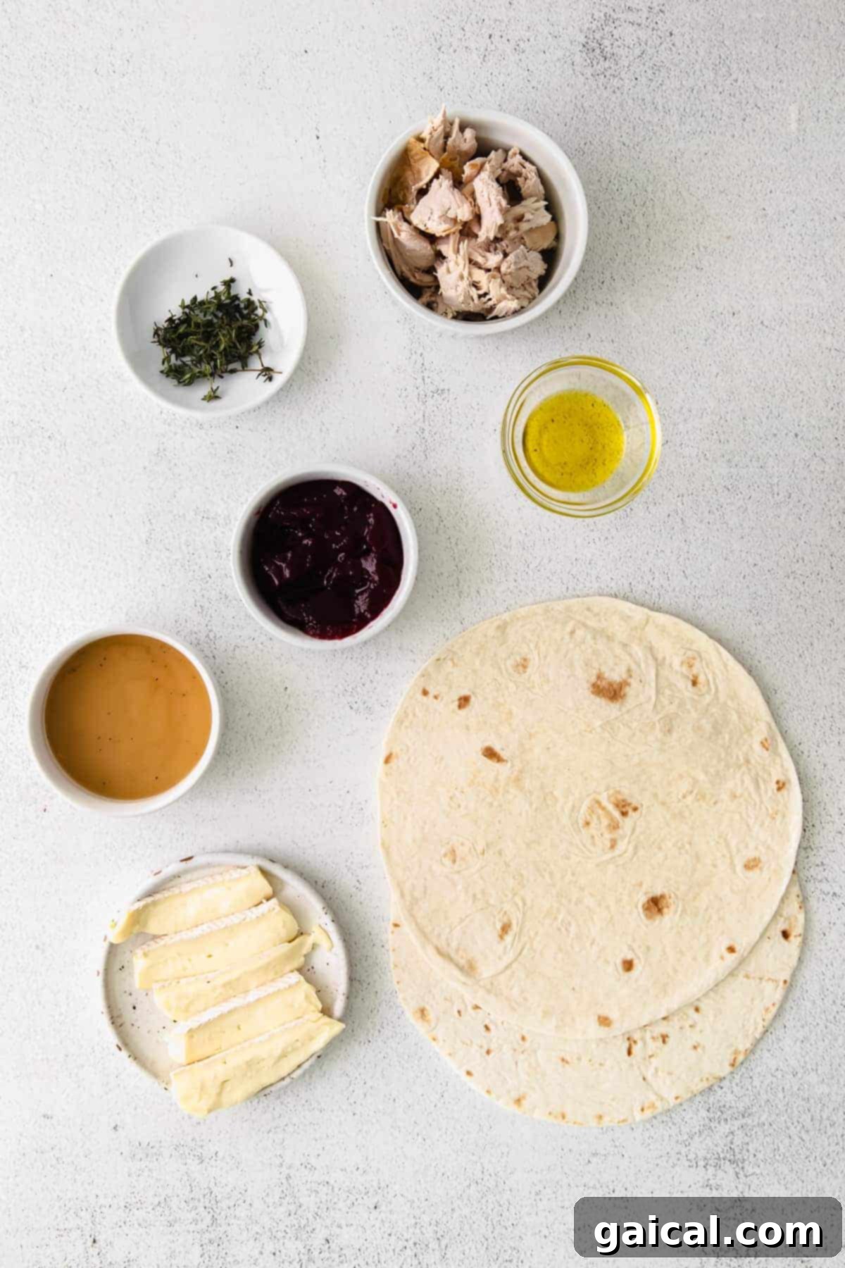 Gather your simple Thanksgiving leftovers for this amazing quesadilla recipe! Ingredients for Leftover Thanksgiving Turkey Quesadilla laid out on a table