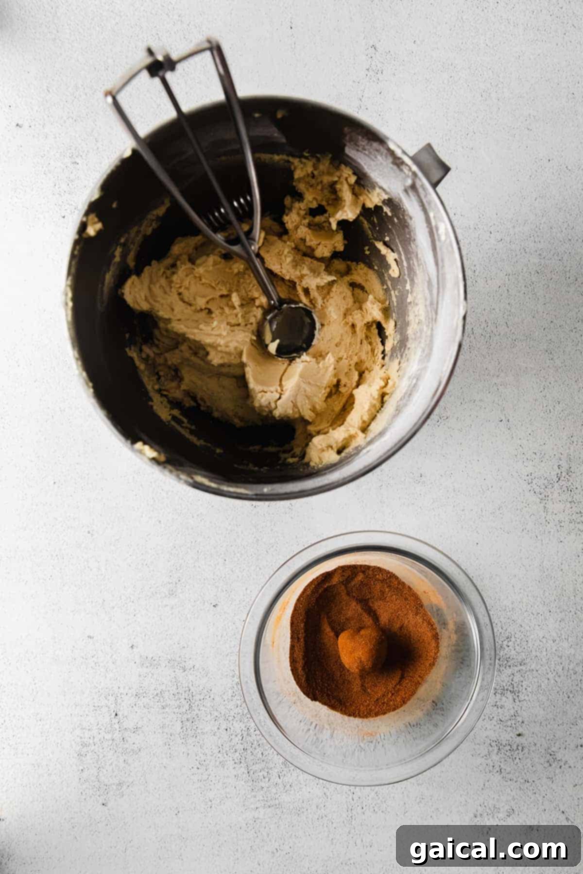 Quick Snickerdoodle Delight 5 Scooping snickerdoodle cookie dough with a cookie scoop from a bowl.