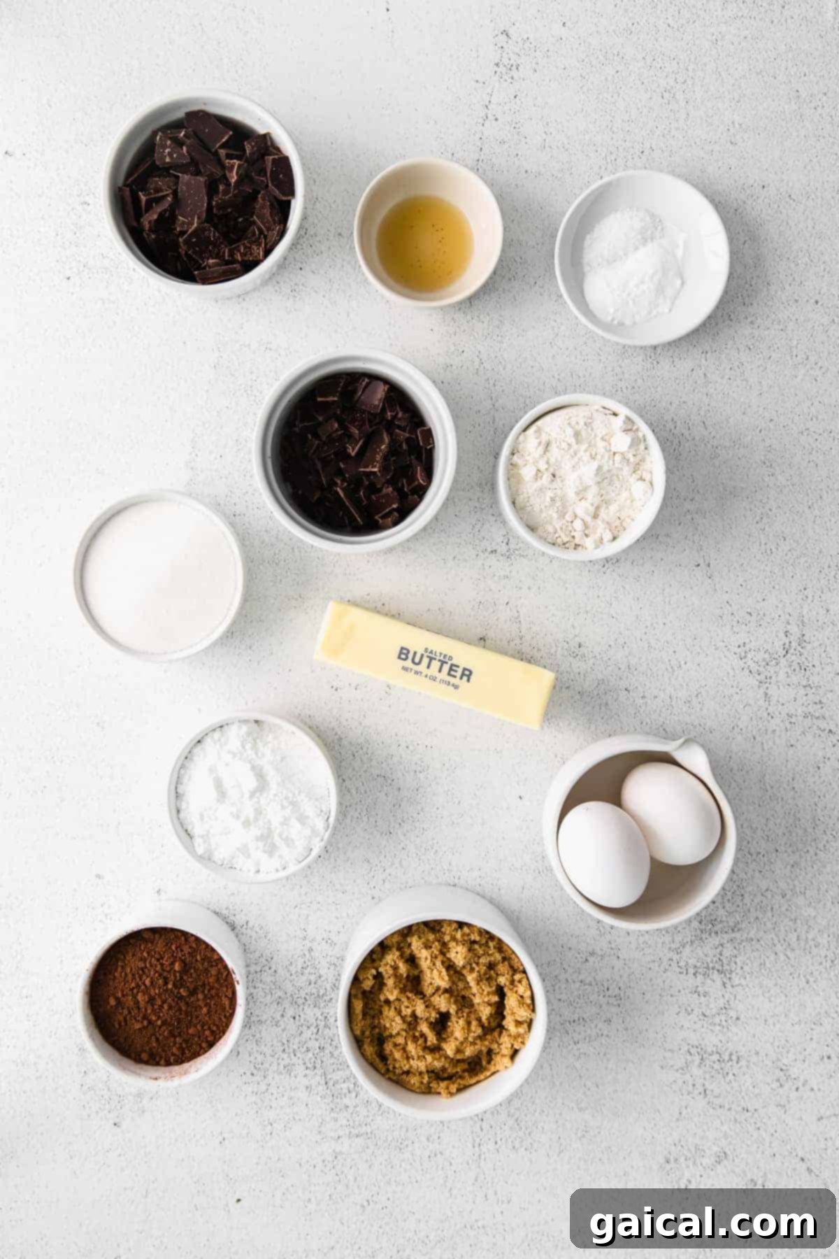 Gathering Your Ingredients for Decadent Crinkles Assorted baking ingredients for crinkle cookies laid out on a kitchen countertop, ready for mixing.
