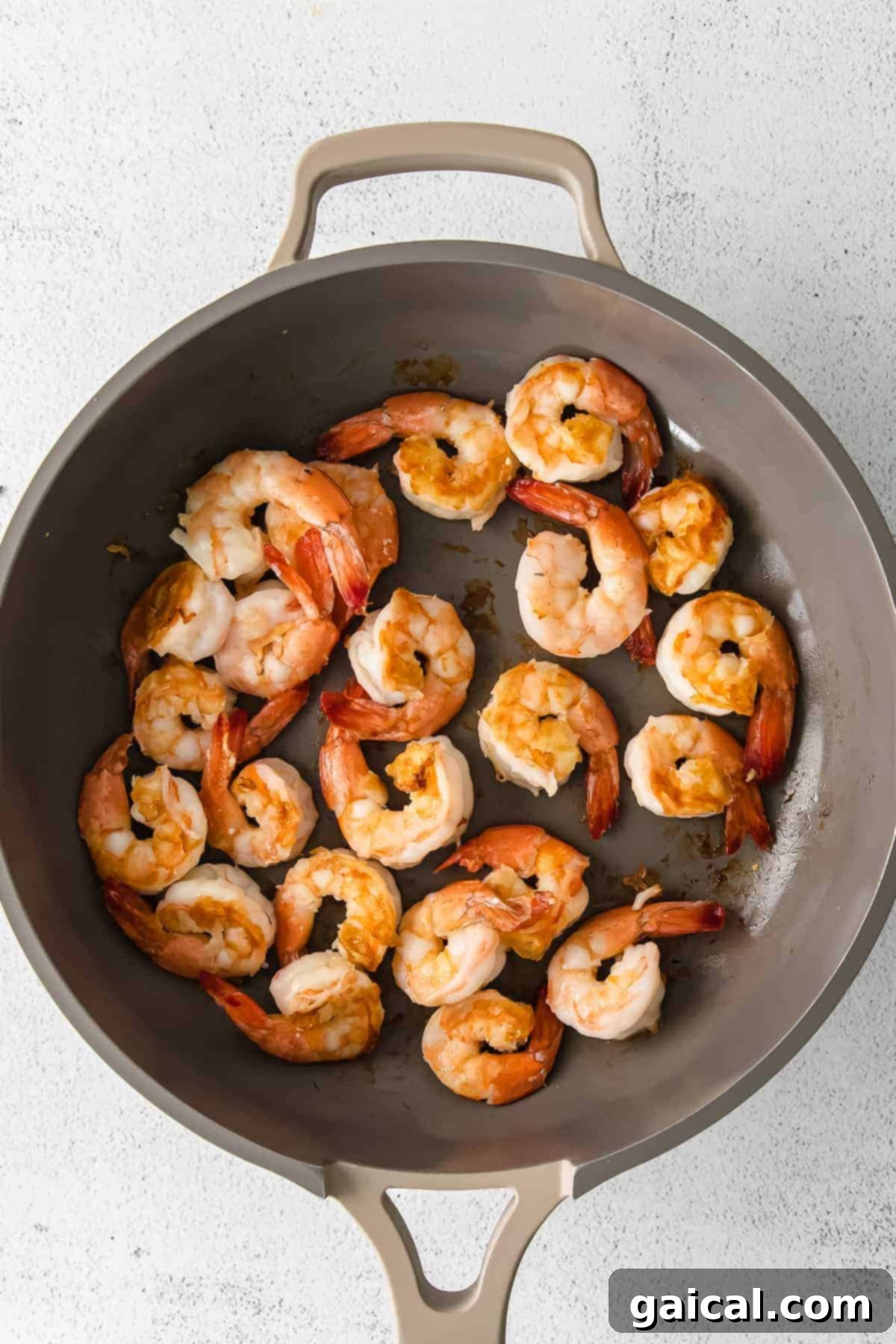 Zesty Lemon Garlic Shrimp 5 Close-up of perfectly cooked shrimp in a hot pan, showing the ideal pink color and slight char.