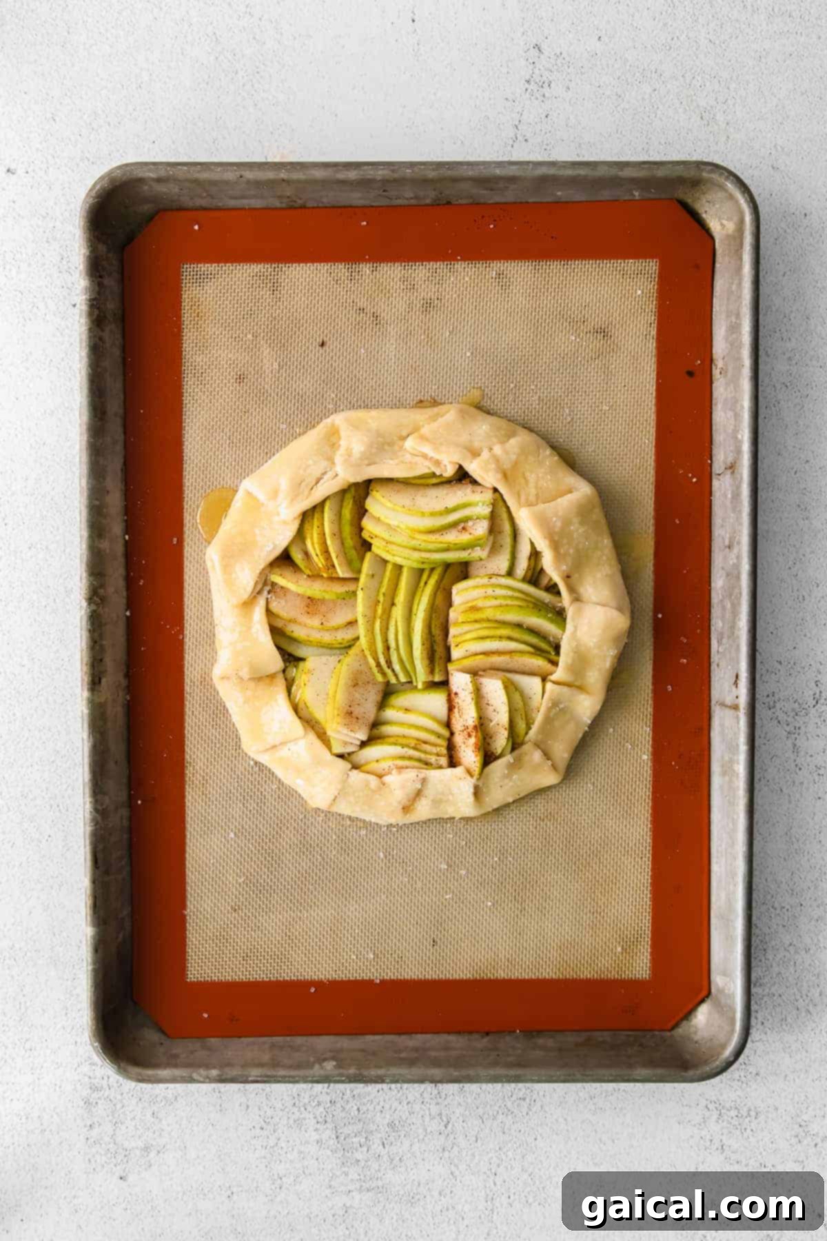 A freshly baked honey pear galette, glistening with a honey glaze and ready to be served.