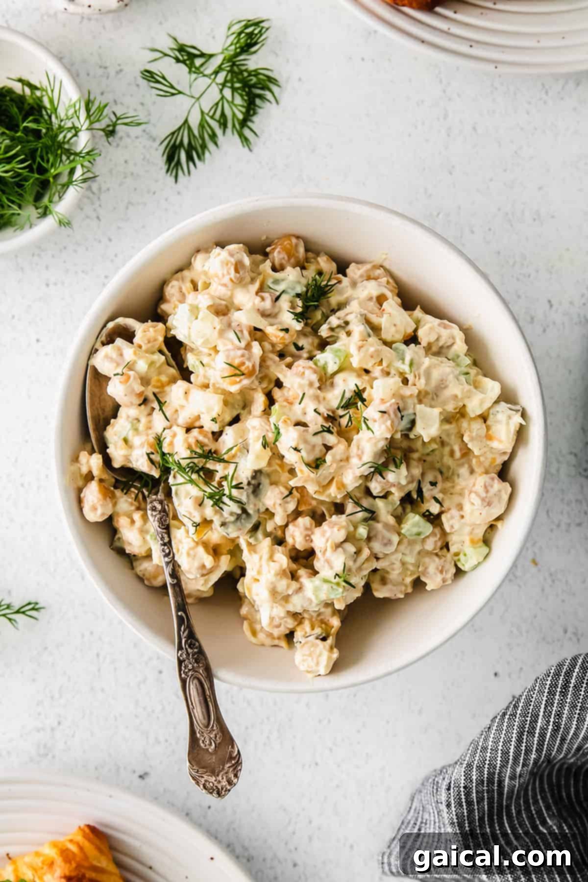 Large bowl of creamy chickpea salad, ready for serving.