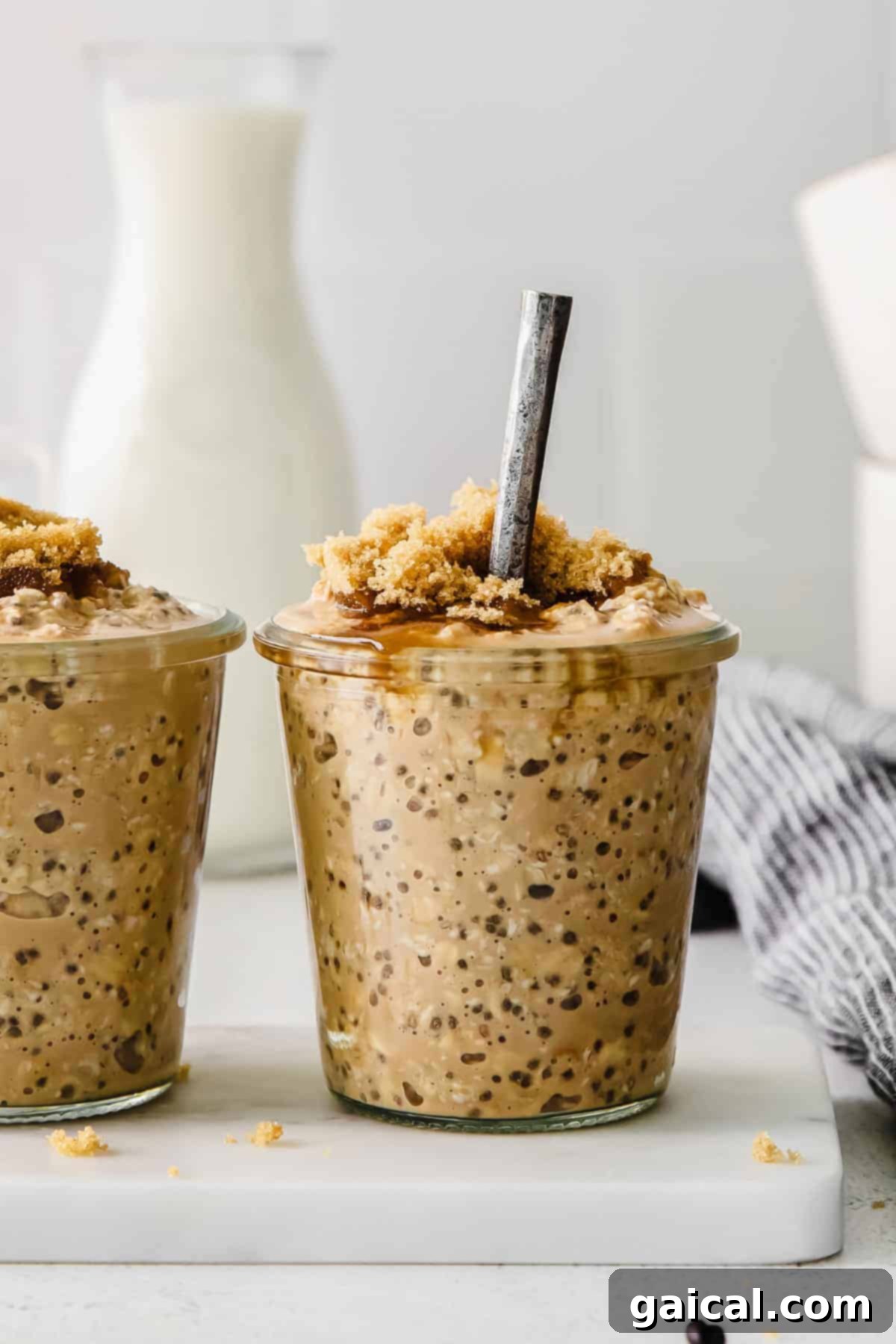 Delicious brown sugar shaken espresso overnight oats in a glass jar, ready to eat.