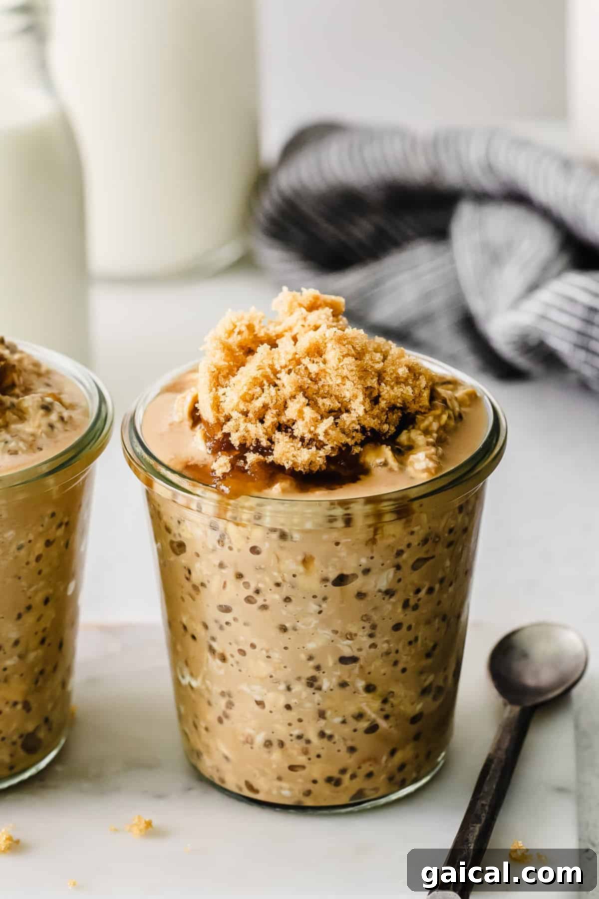 Ready-to-eat coffee oats in a jar, with a spoon.