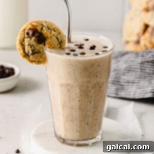 Chocolate Chip Cookie Dough Smoothie in a cup, creamy and garnished with chocolate chips
