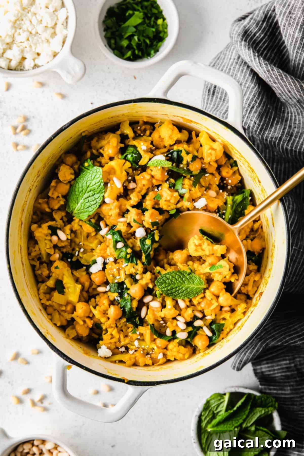 Tek Tencere Marine Nohutlu Sarı Pilav 2 One pot yellow rice with marinated chickpeas, garnished with fresh herbs and feta.