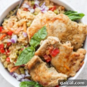 One-pot green curry chicken and rice with creamy coconut milk, garnished with fresh herbs, in a recipe card format.