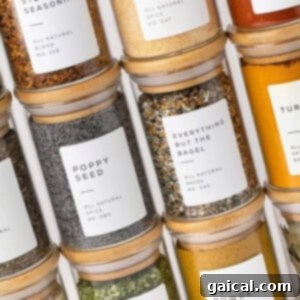 Za'atar Spice From Scratch 2 Collection of clear glass spice jars with labels.
