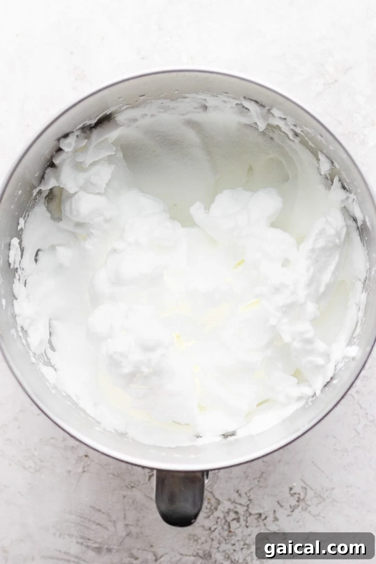 Essential Ingredients for Skillet Cake Freshly separated egg whites in a pristine mixing bowl, ready for whisking.