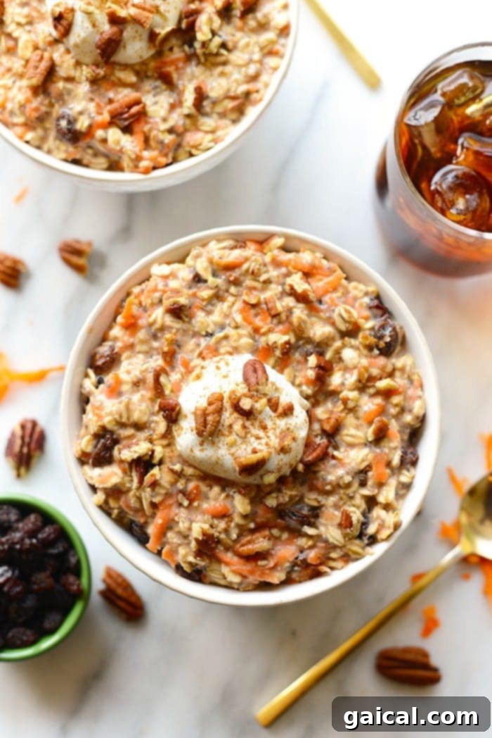 Dreamy Carrot Cake Overnight Oats 4 A single serving of Carrot Cake Overnight Oats in a glass jar with a spoon, showing the creamy texture and carrot pieces.