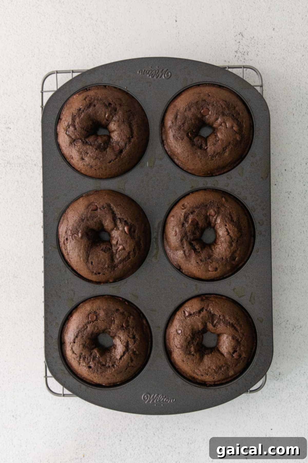 Freshly Baked Chocolate Donuts Baked chocolate donuts in a donut pan, fresh from the oven