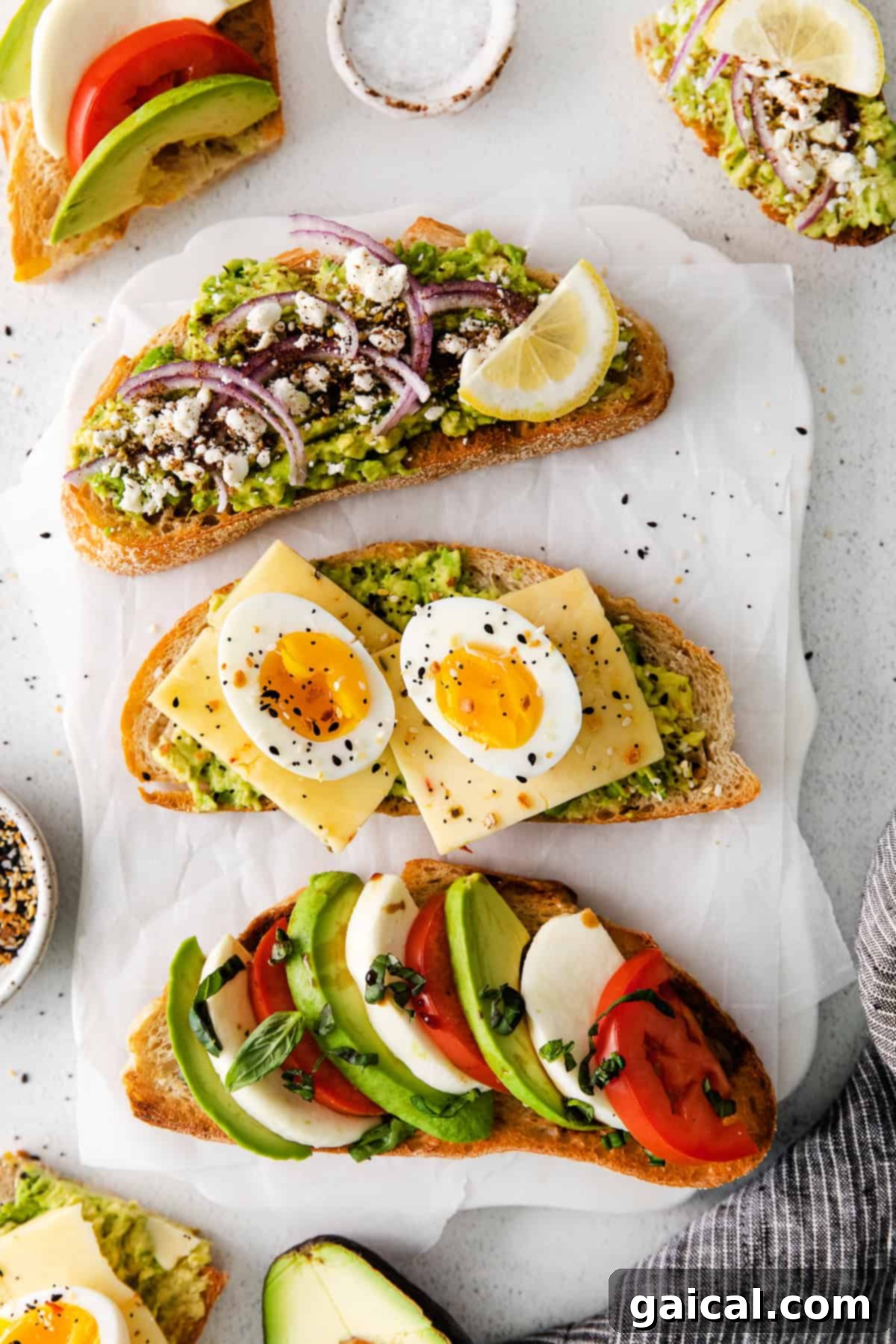 3 slices of avocado toast on a plate, featuring Mediterranean, Caprese, and Egg variations