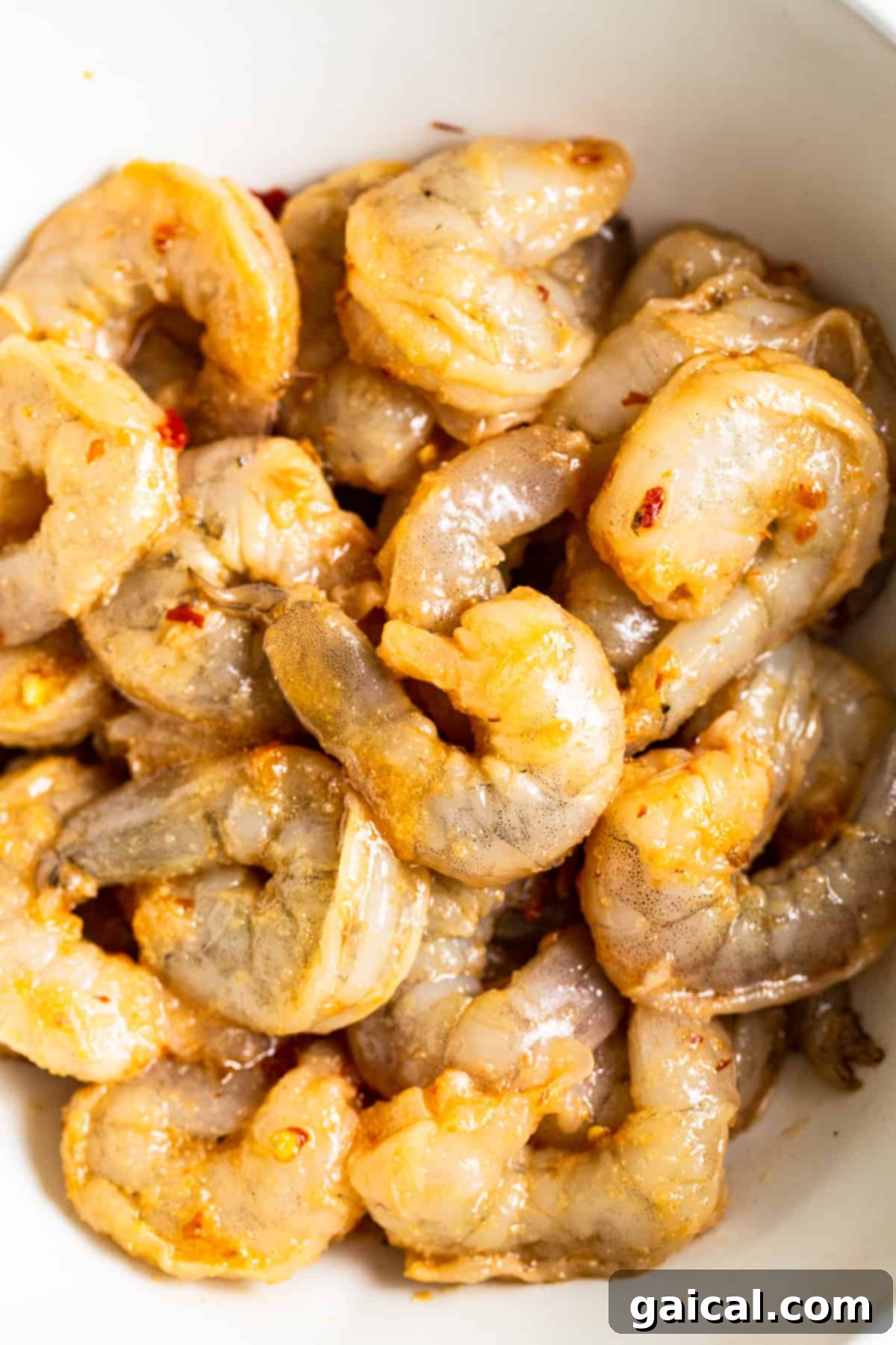 Perfectly Marinated Shrimp for Fried Rice Fresh shrimp marinating in a savory sauce, prepared for stir-frying