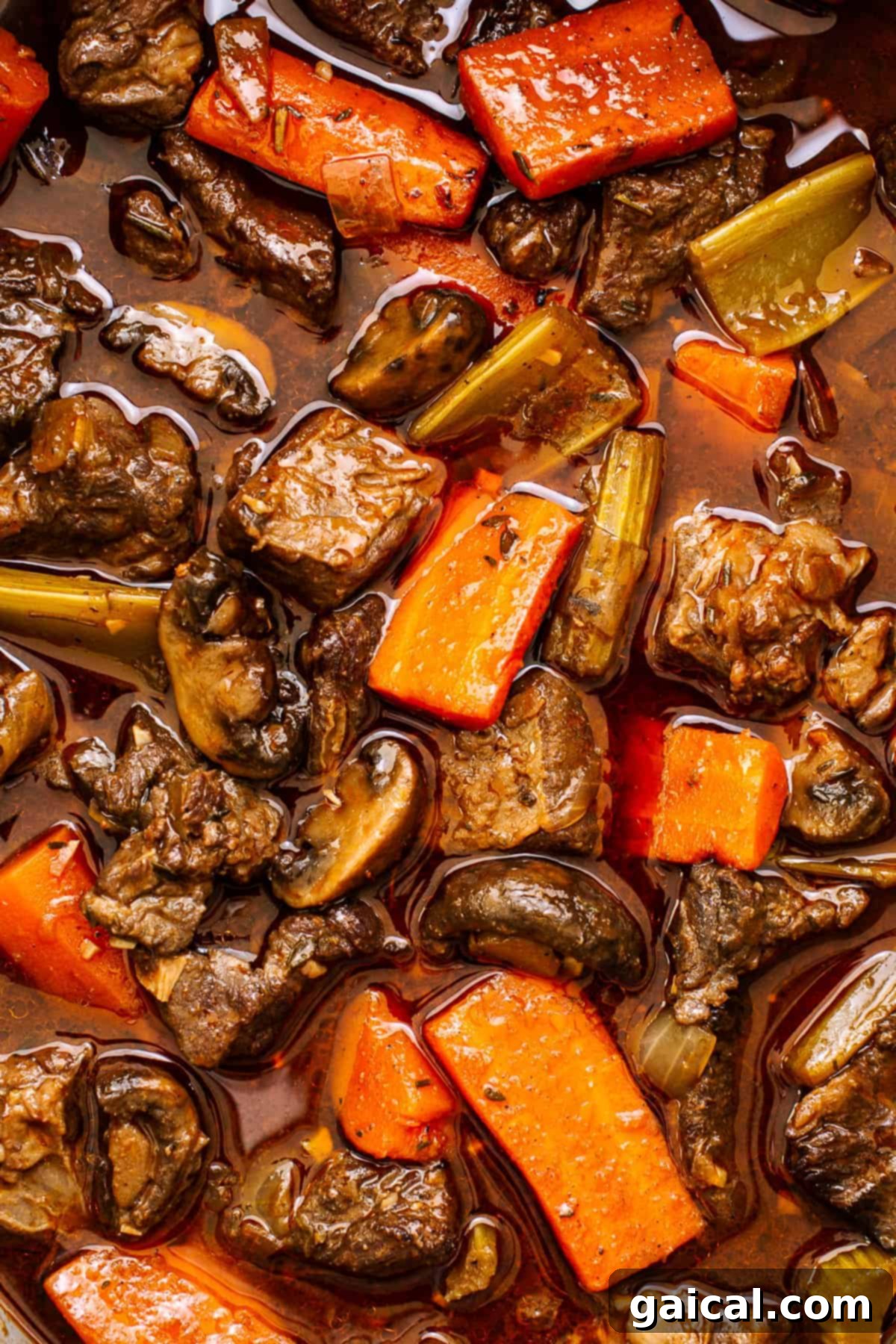 Guinness beef stew after simmering, showing its rich, dark broth and tender ingredients.