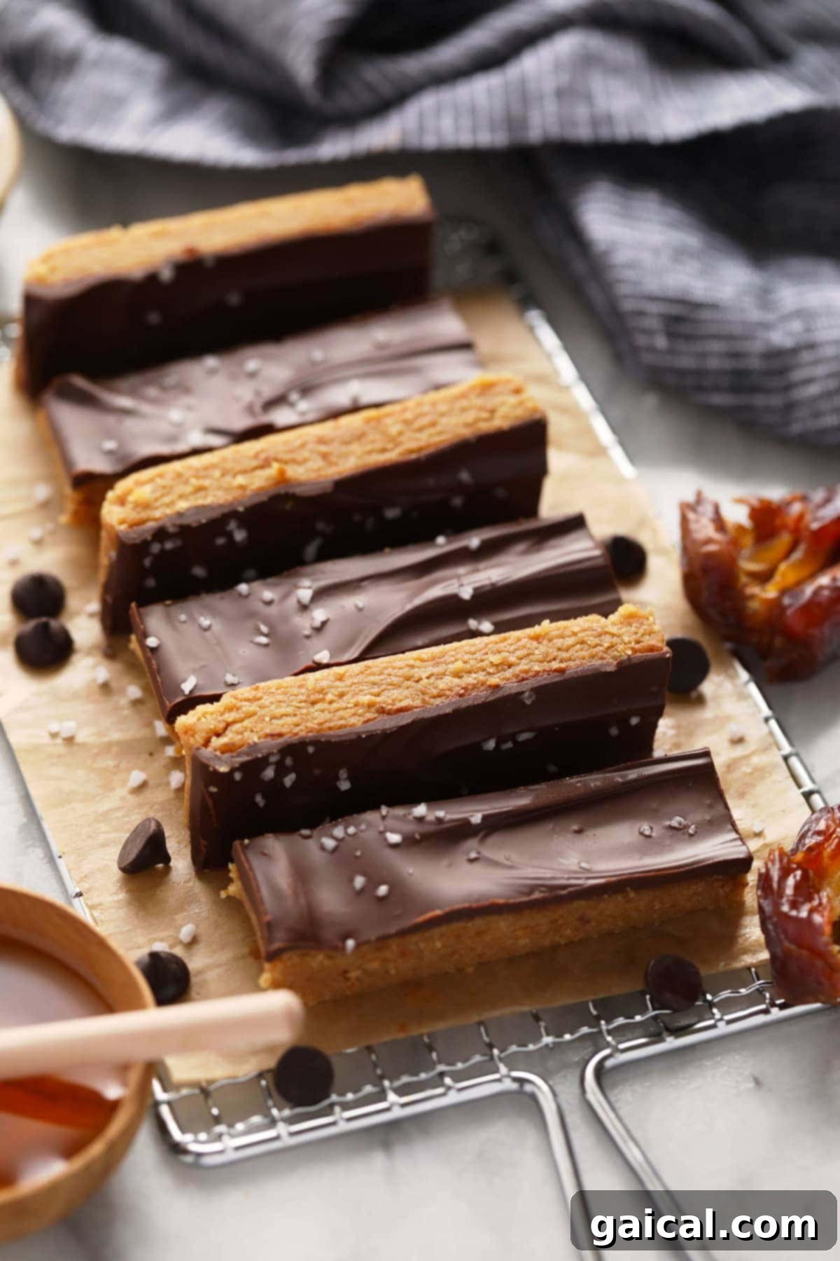 Perfectly Sliced Peanut Butter Protein Bars, Ready to Store. Neatly sliced homemade peanut butter protein bars, showing their soft, chewy interior and ready for storage.