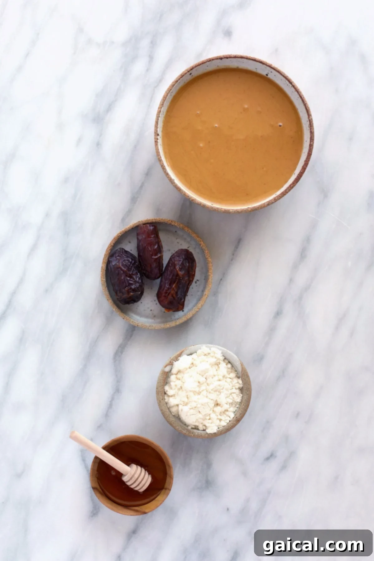 Simple, Wholesome Ingredients for the Best Homemade Protein Bars. A vibrant display of fresh, simple ingredients for homemade protein bars, including Medjool dates, natural peanut butter, honey, oats, and vanilla protein powder.