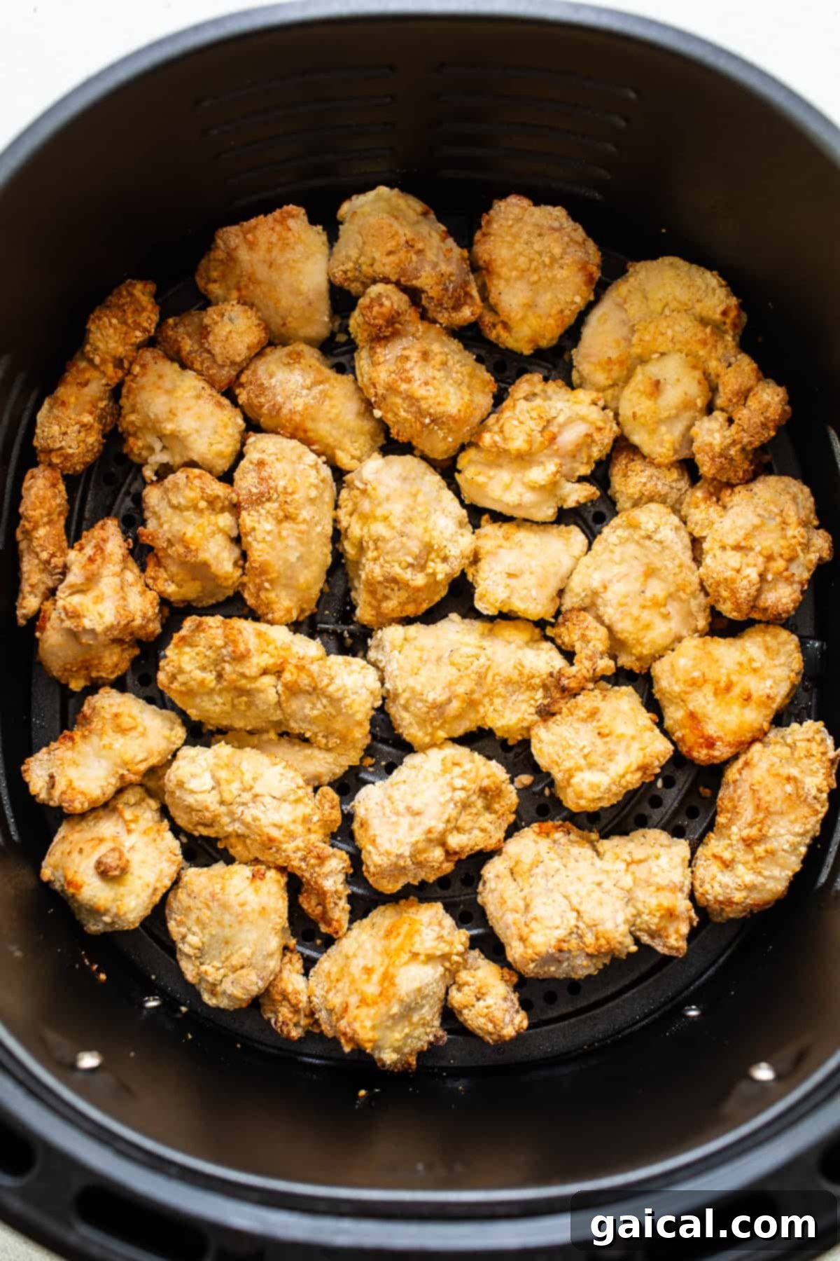 You will love this air fryer honey sesame chicken recipe. It's made with lean chicken breast and a yummy honey sesame sauce and then air-fried to make the chicken super crispy without deep frying. chicken in air fryer