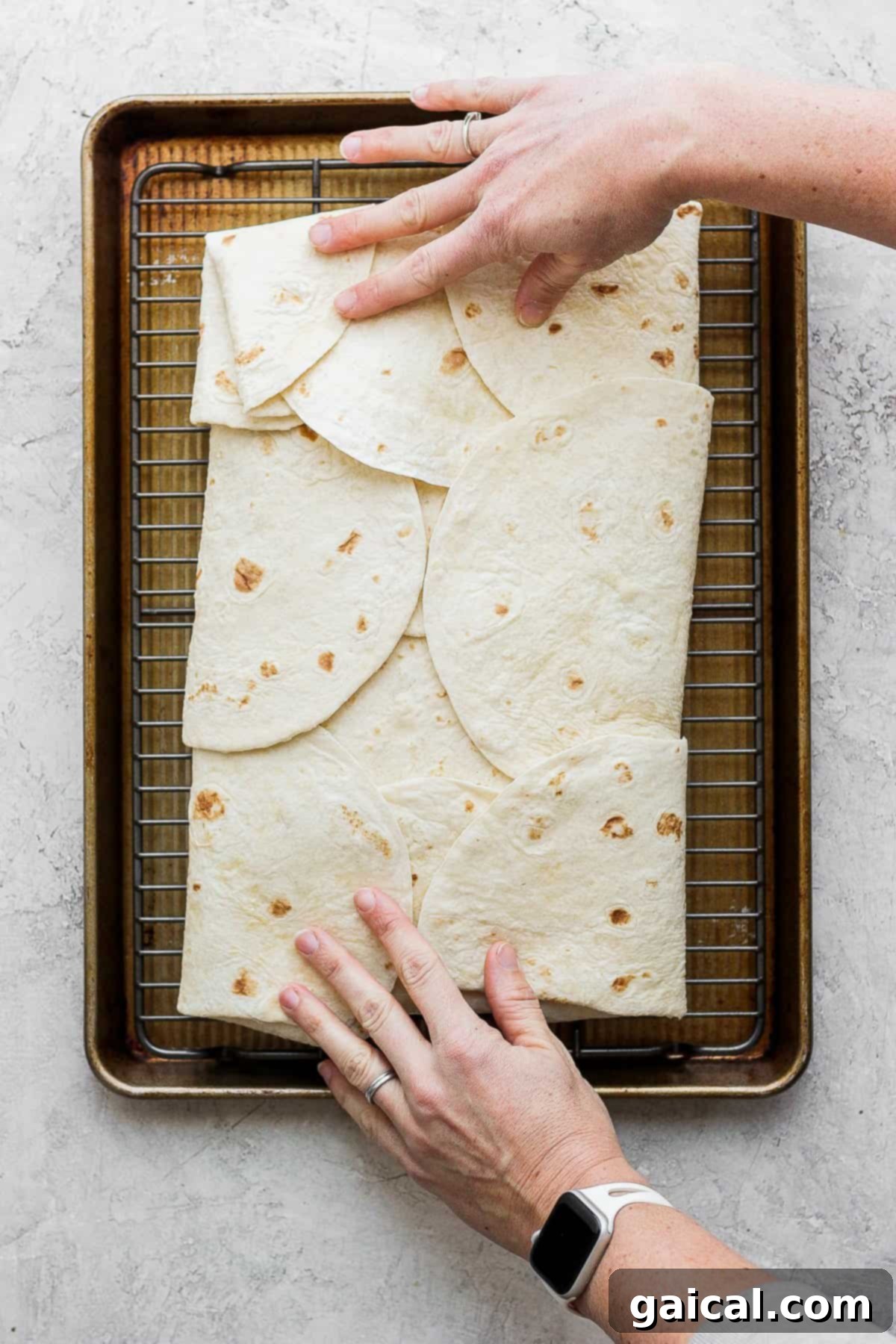 Sheet Pan Quesadilla Party 5 The large sheet pan quesadilla, tightly folded and pressed with another baking sheet, ready for the oven.