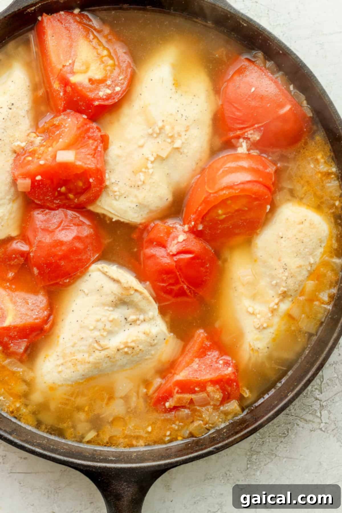 Smoky Chipotle Chicken 5 Chicken and tomatoes simmering in a skillet.