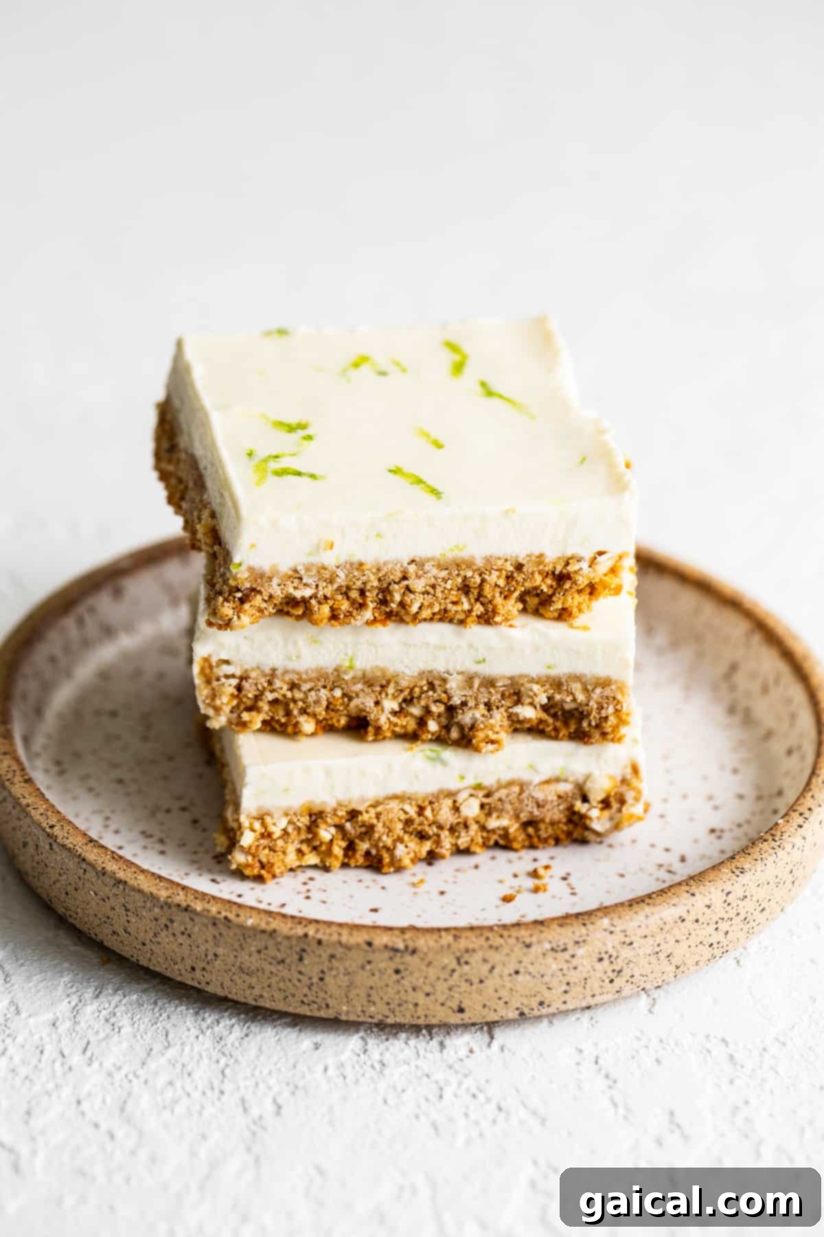 Stack of perfectly sliced Margarita Pie Bars, showcasing the creamy filling and salty pretzel crust.