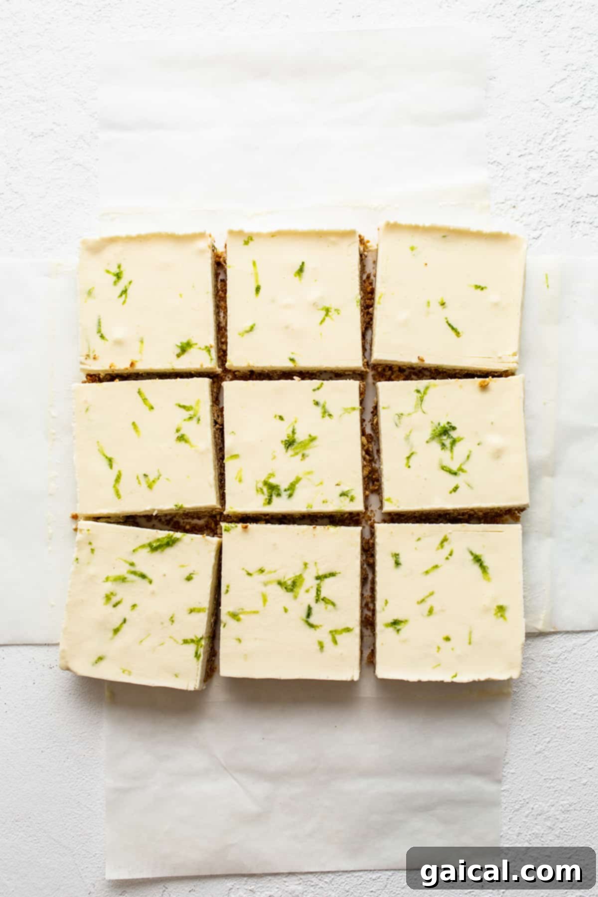 Perfectly sliced Margarita Pie Bars arranged on parchment paper, ready to be served or stored.