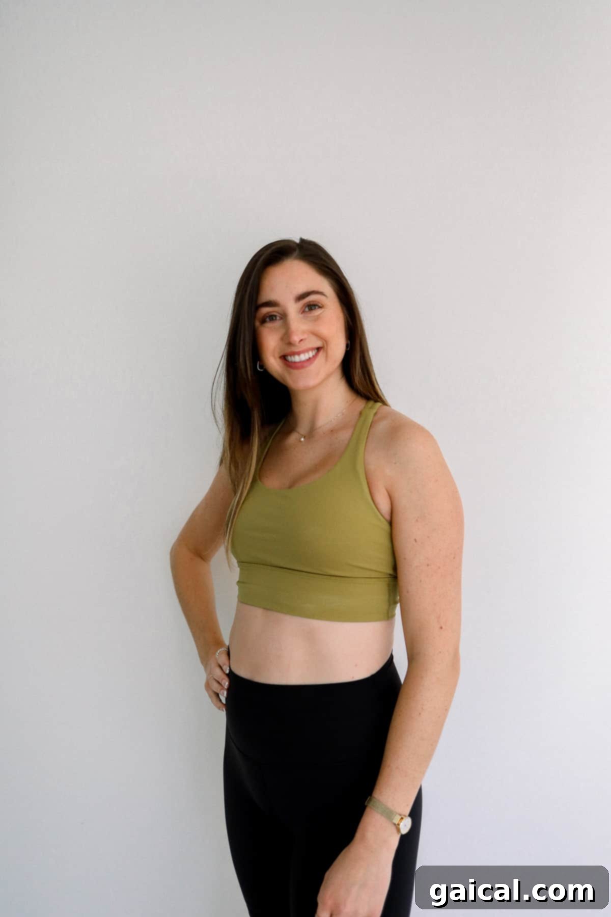 Lululemon Energy Bra for Pregnancy Woman wearing a Lululemon Energy Bra, a classic choice for medium-support high-impact workouts during pregnancy.