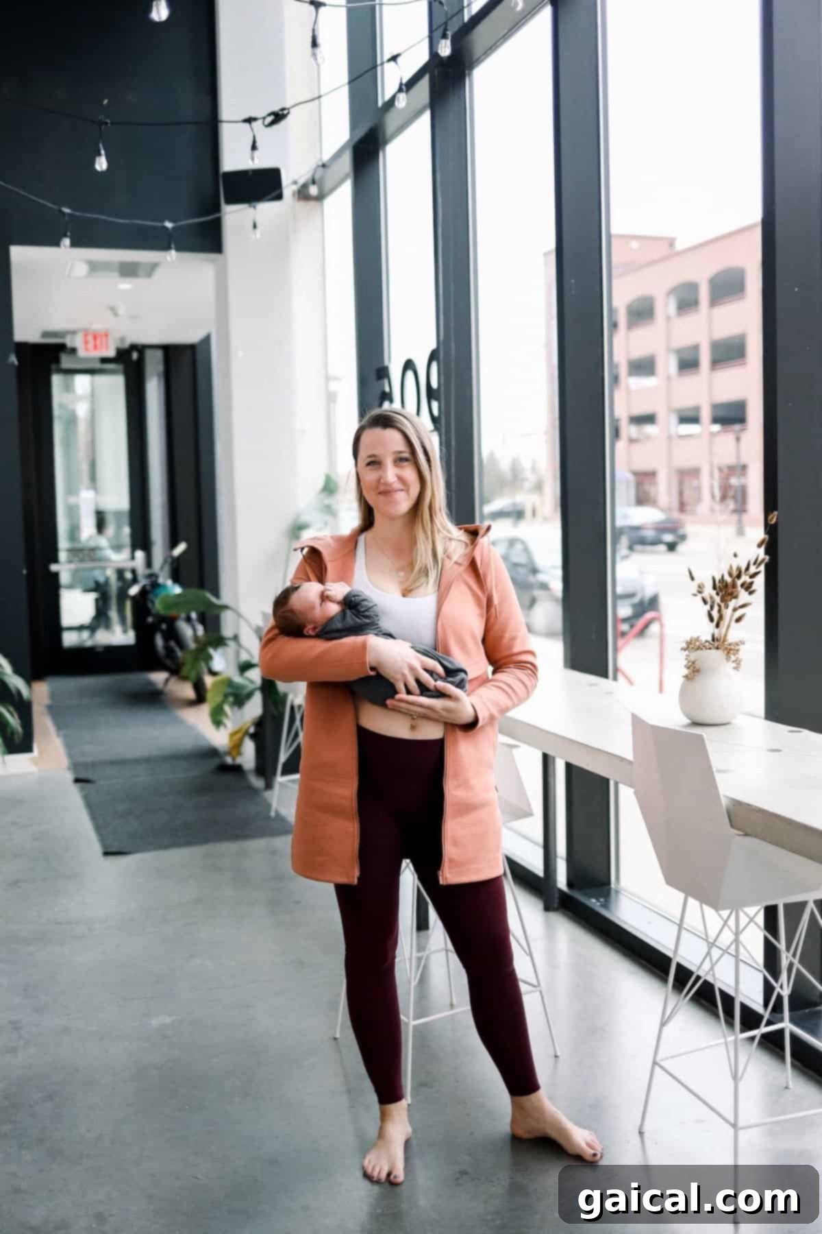 Lululemon Align Leggings for Postpartum Mother holding a baby, wearing Lululemon Align Leggings, ideal for postpartum recovery and daily wear.