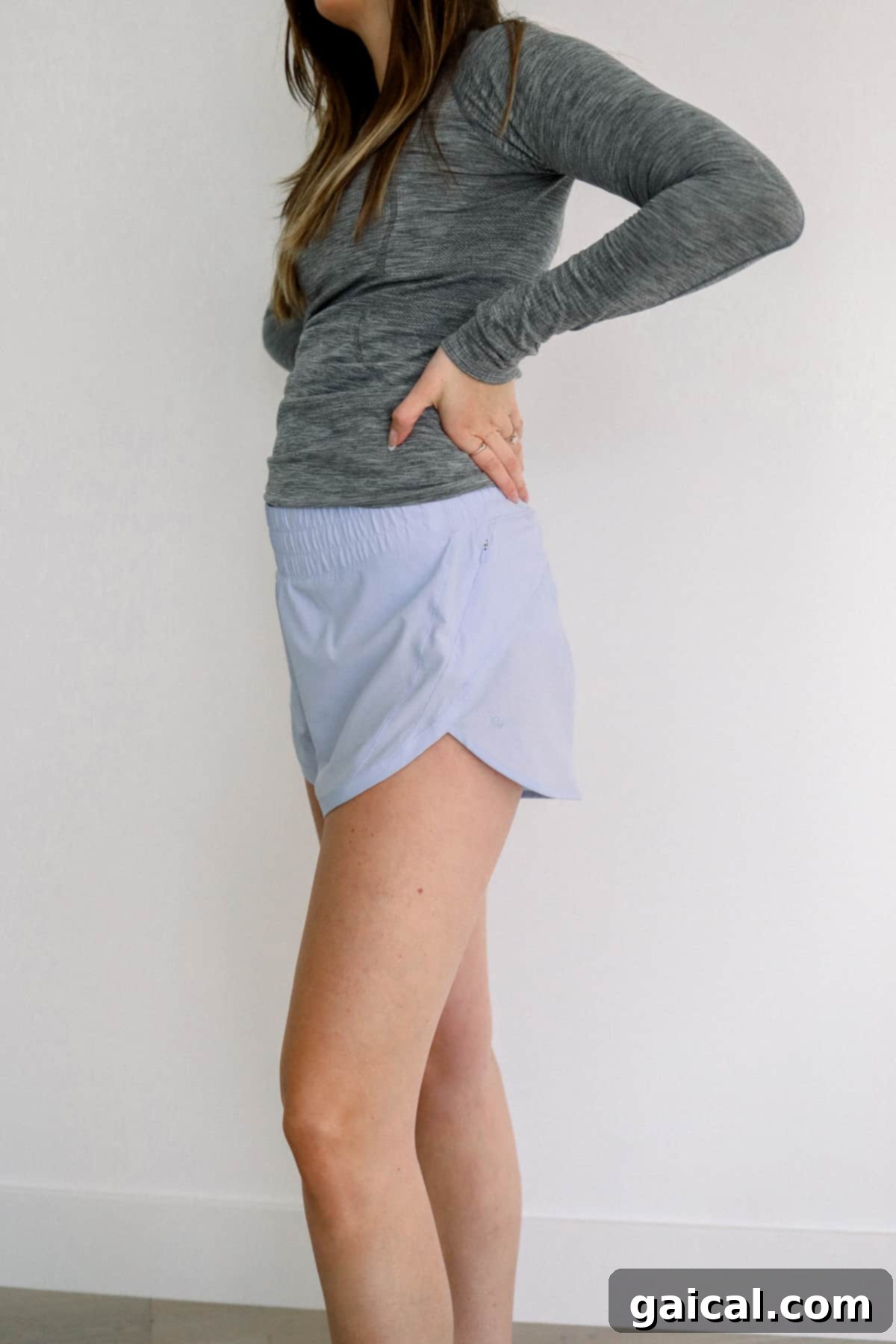 Lululemon Track That Shorts for Pregnancy Woman wearing Lululemon Track That Mid-Rise Shorts, designed for comfortable movement during maternity.