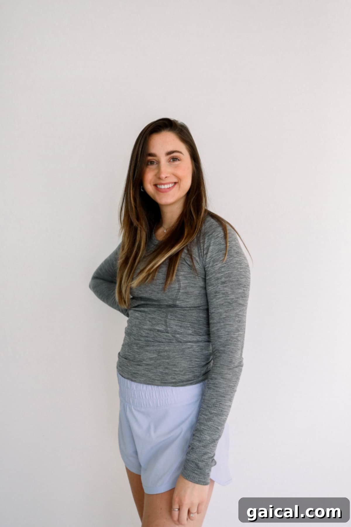 Lululemon Swiftly Tech Long Sleeve Maternity Woman wearing a Lululemon Swiftly Tech Long Sleeve shirt, a comfortable option for cooler maternity days.