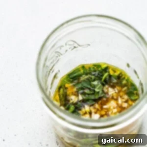 Kaleidoscope Chicken Skewers 13 A mason jar filled with ingredients for the vegetable marinade, ready to be shaken.