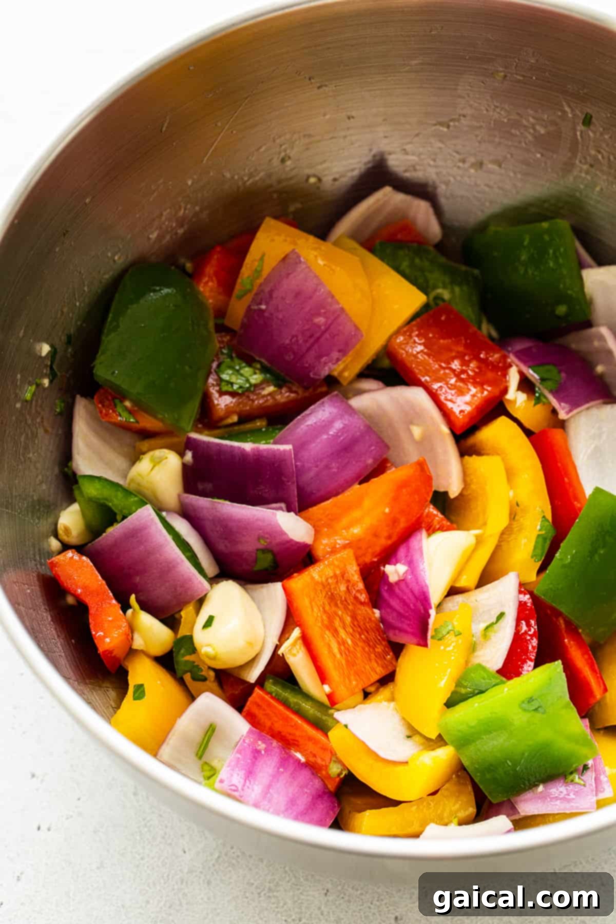 Kaleidoscope Chicken Skewers 7 Assorted rainbow vegetables marinating in a bowl, glistening with marinade.