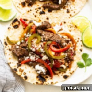 Steak fajitas in a skillet, ready to be served.