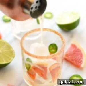 A zesty glass of grapefruit margarita with a hint of jalapeños.