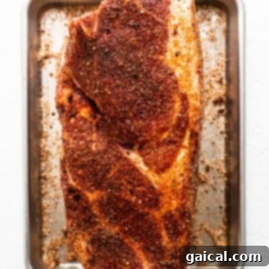 Pork shoulder sprinkled with dry rub.