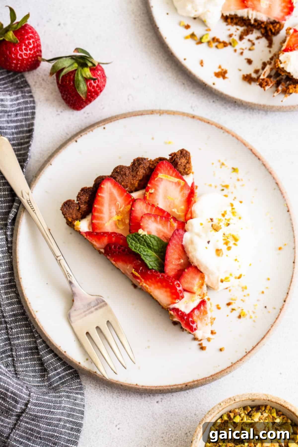 Pistachio-Crusted Strawberry Delight 2 A stunning strawberry tart with a golden crust and fresh strawberries, ready to be served.