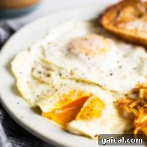 A plate with a fried egg, potatoes and a jar of peanut butter, showcasing the finished dish.