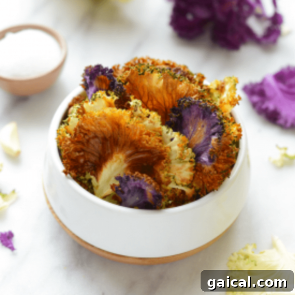 Cauliflower florets in a bowl with purple flowers.