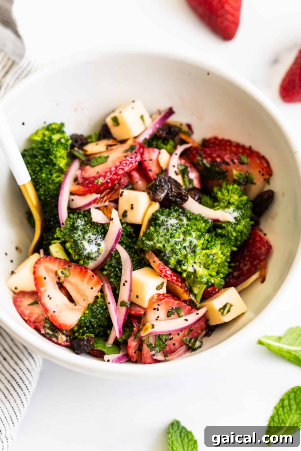 Refreshing Strawberry Broccoli Salad A large serving of strawberry broccoli salad in a bowl, highlighting the vibrant colors and fresh ingredients.