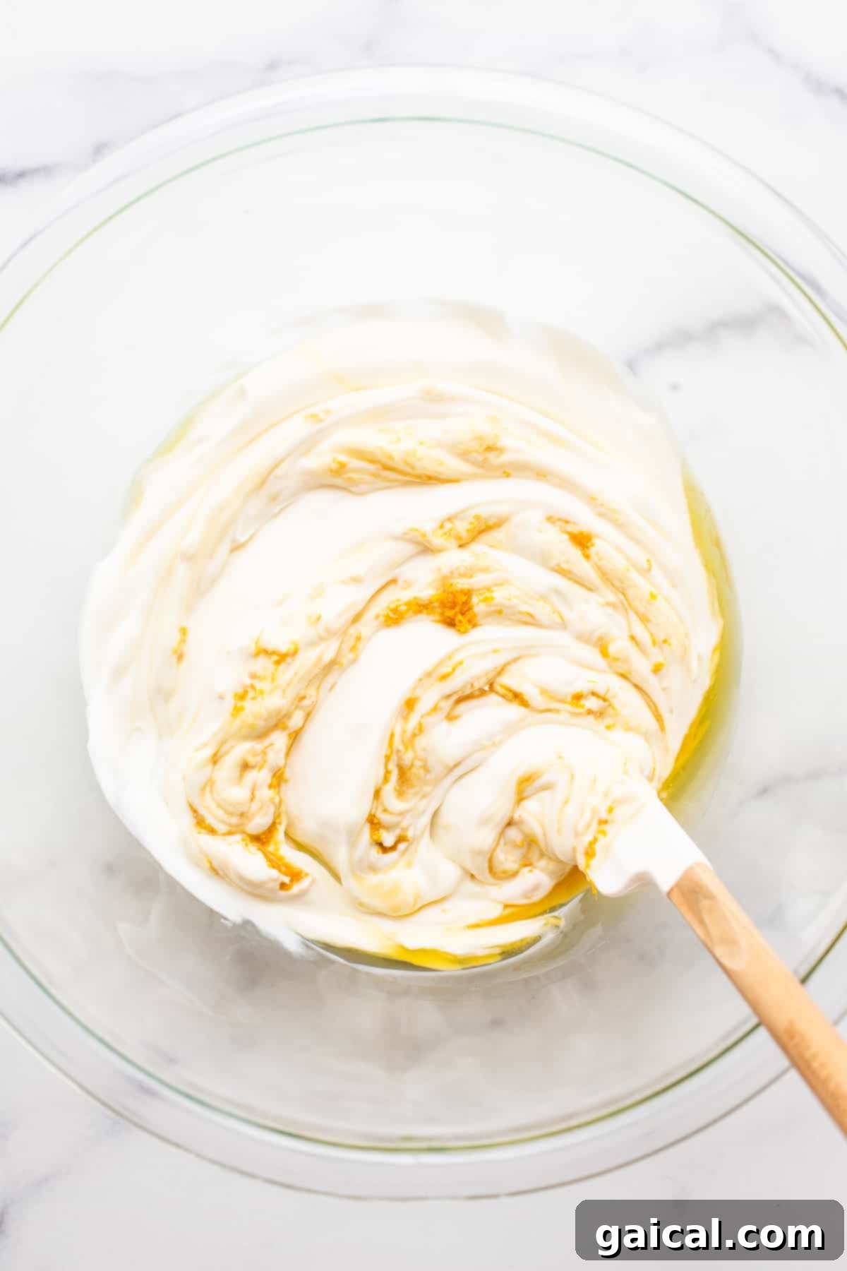 All six fruit dip ingredients perfectly blended into a smooth, creamy mixture in a white bowl, ready for serving.