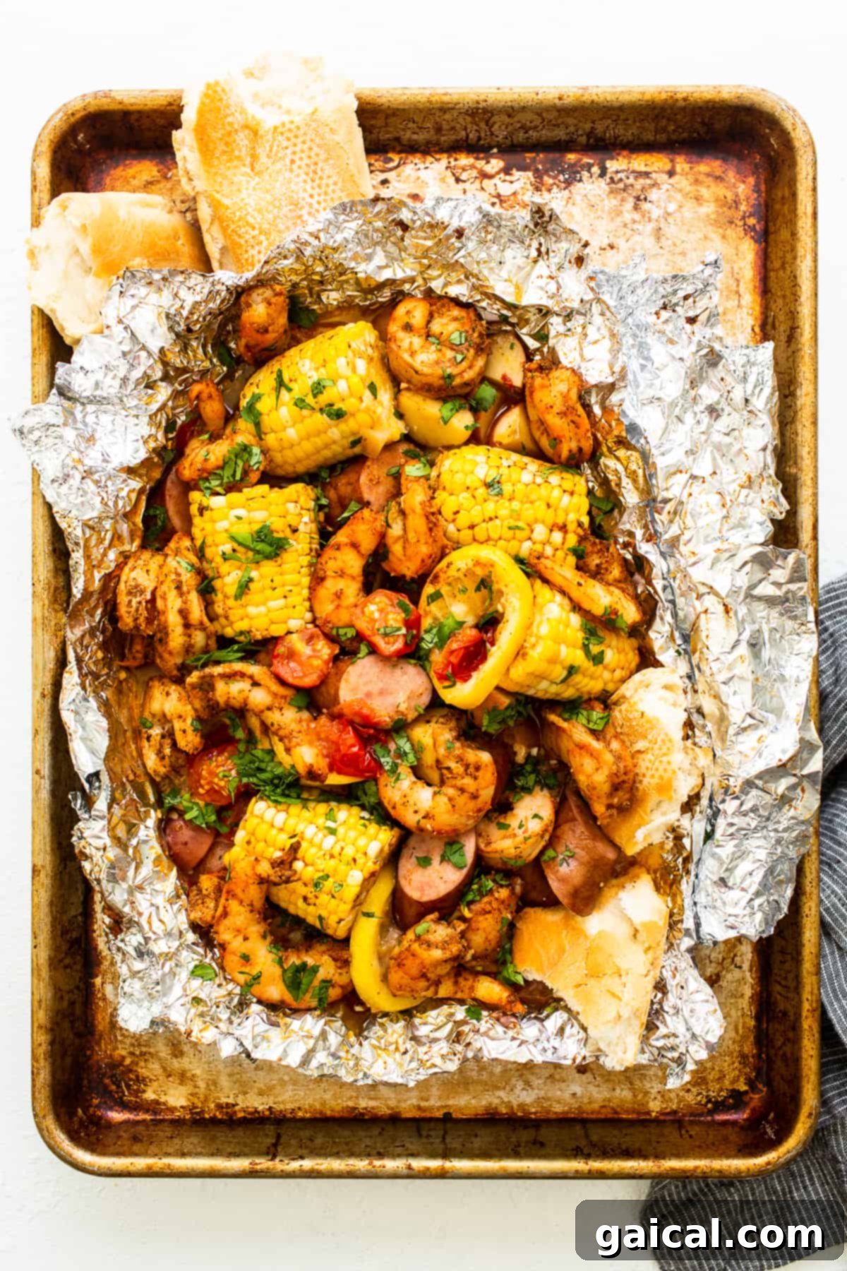 Zesty Shrimp Grill Parcels 2 Shrimp foil packet full of ingredients, colorful and ready to eat, served on a platter.