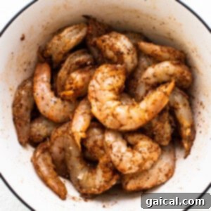 Zesty Shrimp Grill Parcels 9 Shrimp sitting in old bay seasoning.