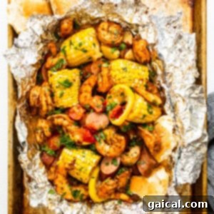 Zesty Shrimp Grill Parcels 12 Shrimp foil packet full of ingredients.