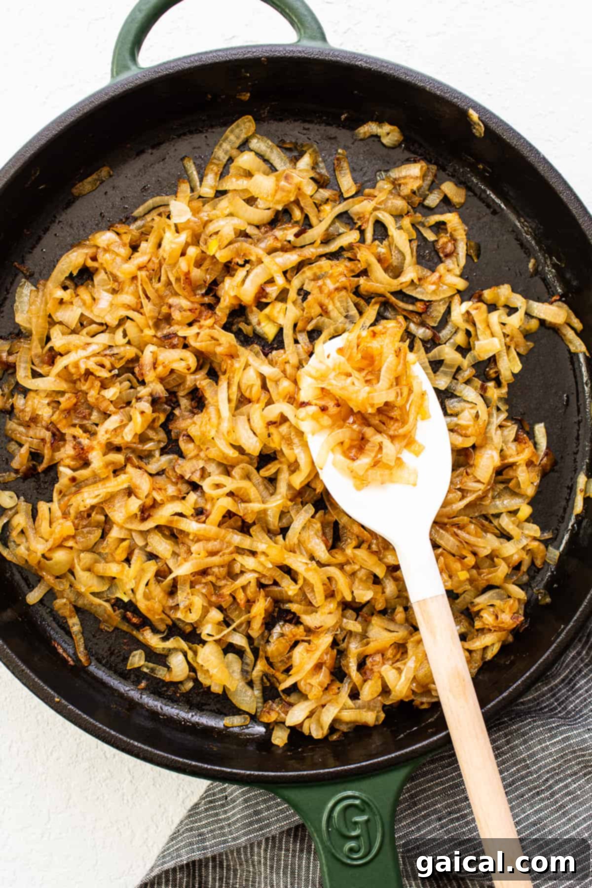Effortless Caramelized Onions 2 Deeply browned, glistening caramelized onions perfectly cooked in a skillet, ready to be served or stored.