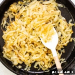 Effortless Caramelized Onions 10 Onions in a skillet after 30 minutes of cooking, showing initial softening and slight translucency.