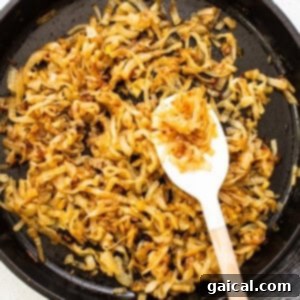 Effortless Caramelized Onions 11 Perfectly browned and glistening caramelized onions in a skillet, showcasing their rich color.