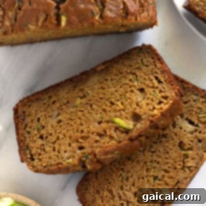 Zucchini bread slices on a plate, showcasing a lighter, classic version.
