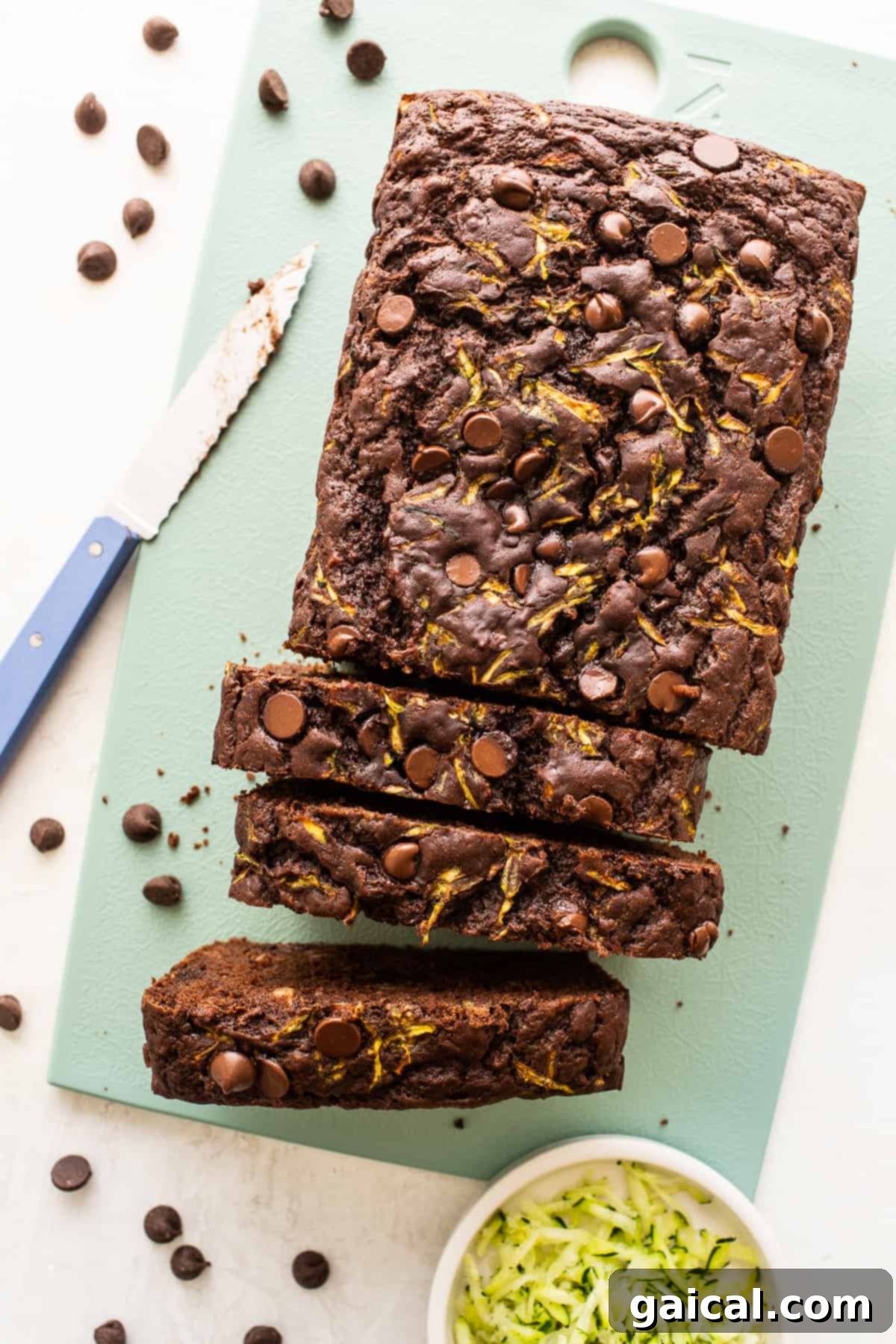 A loaf of chocolate zucchini bread, beautifully sliced and ready to be served.